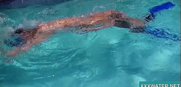 Hot brunette slut Candy swims underwater
